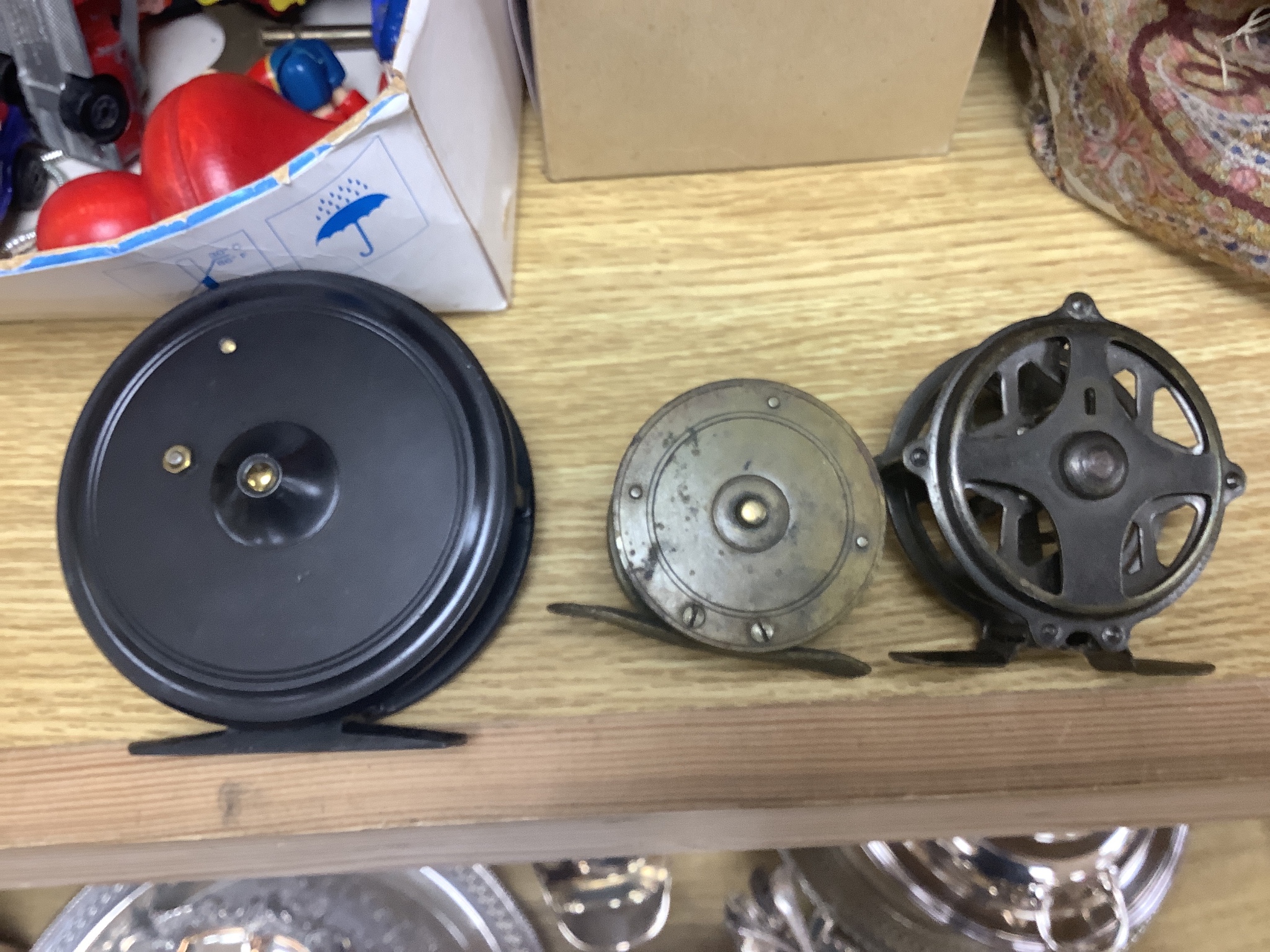 Three fishing reels, flies, lines etc., and a collection of Noddy and Mickey Mouse toys